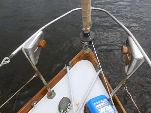 Slide: The Image of Bow of 1961 Rhodes Swiftsure sailboat with stainless steel fittings and ropes. - 45