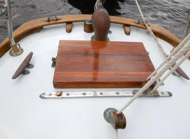 Slide: The Image of Deck of 1961 Rhodes Swiftsure sailboat with wooden hatch and nautical fittings. - 49