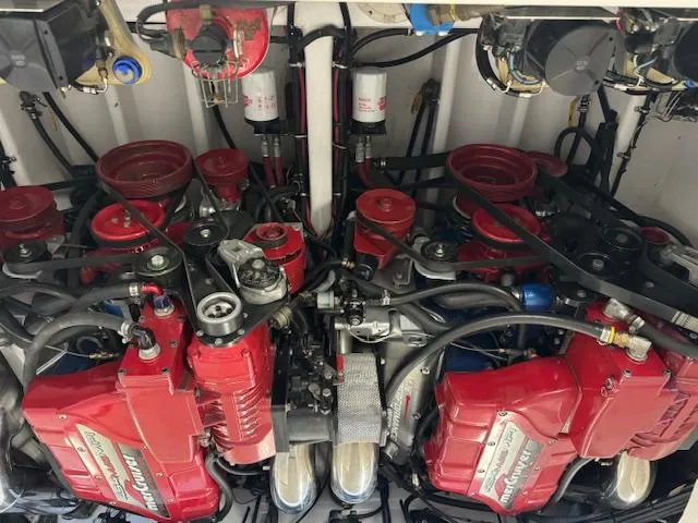 Slide: The Image of 2004 Fountain 35 Executioner twin engines with red covers and complex wiring. - 11