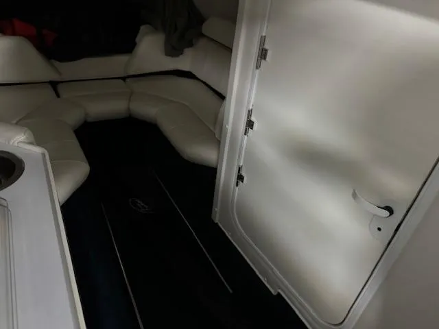 Slide: The Image of Interior cabin of a 2004 Fountain 35 Executioner boat with white leather seating. - 14