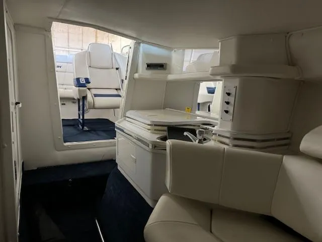 Slide: The Image of Interior of 2004 Fountain 35 Executioner boat with white seating and cabinetry. - 21
