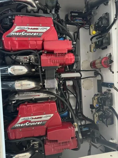 Slide: The Image of 2004 Fountain 35 Executioner engine compartment with twin MerCruiser engines. - 5