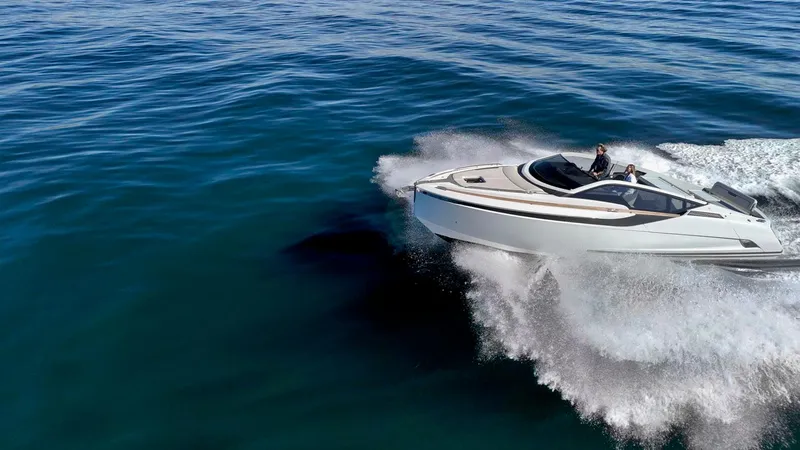 Slide: The Image of 2021 Fairline Fline 33 cruising on open water, showcasing sleek design and performance. - 12