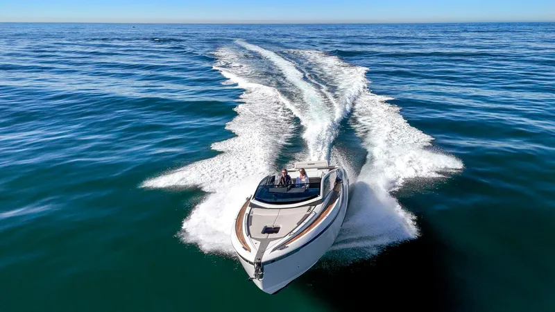 Slide: The Image of 2021 Fairline Fline 33 yacht cruising on open sea. - 14