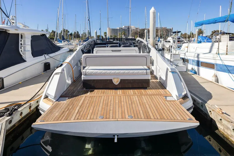 Slide: The Image of 2021 Fairline Fline 33 yacht docked at marina, showcasing spacious deck and seating. - 22