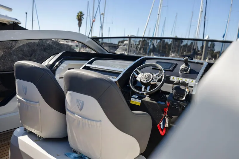 Slide: The Image of Interior of 2021 Fairline Fline 33 yacht with modern steering and controls. - 25