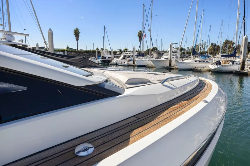 Slide: The Image of 2021 Fairline Fline 33 yacht docked in a marina with sailboats. - 28