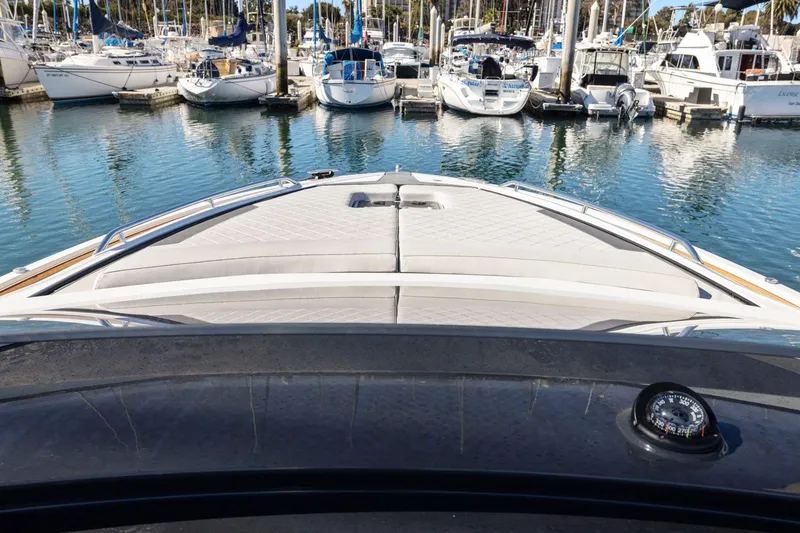 Slide: The Image of 2021 Fairline Fline 33 yacht bow view in marina with surrounding boats. - 35