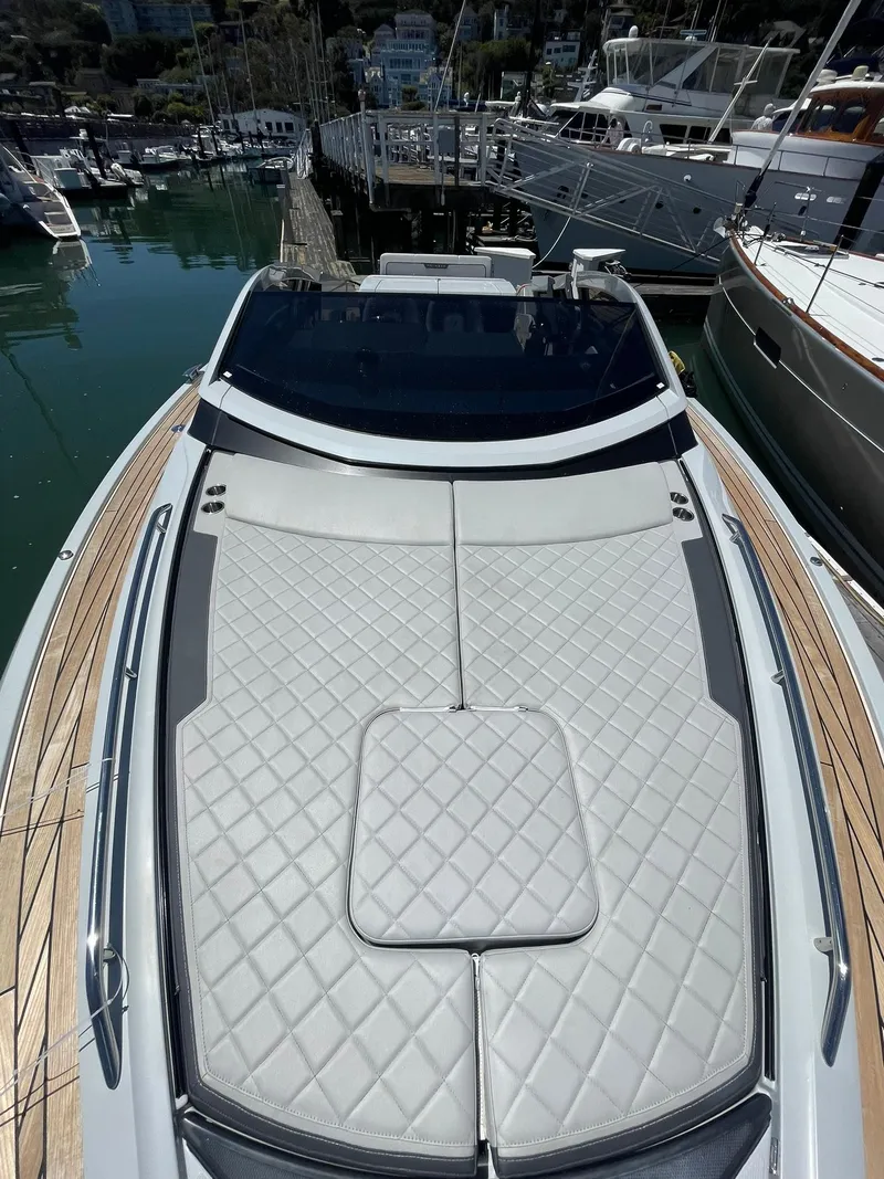 Slide: The Image of 2021 Fairline Fline 33 luxury yacht with spacious sunbathing deck at marina. - 40