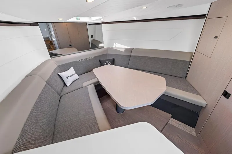 Slide: The Image of Luxurious interior of 2021 Fairline Fline 33 yacht with modern seating and table. - 42
