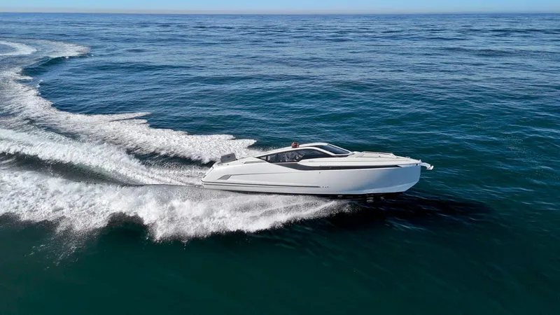 Slide: The Image of 2021 Fairline Fline 33 yacht cruising on open sea. - 6