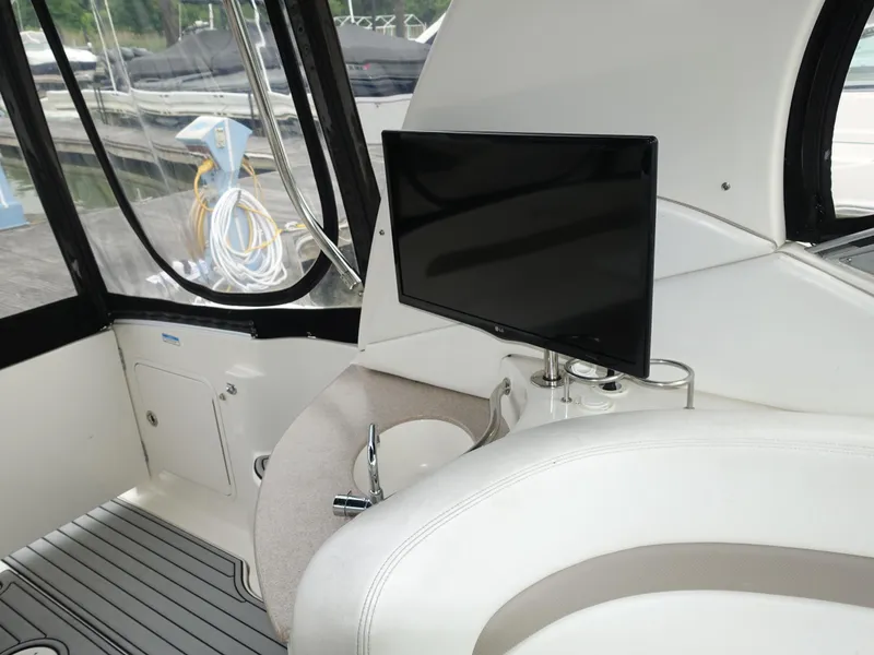 Slide: The Image of Interior of 2005 Sea Ray 320 Sundancer with TV and seating area. - 12