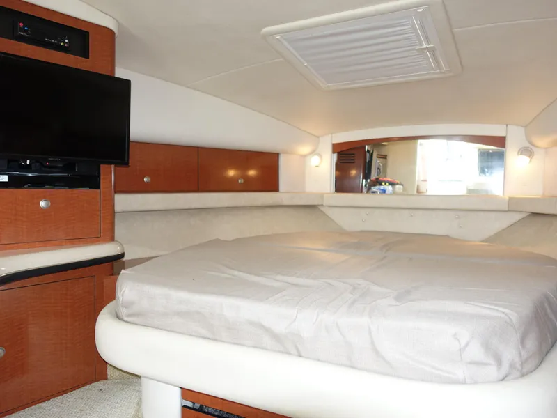 Slide: The Image of Interior cabin of 2005 Sea Ray 320 Sundancer with bed and TV. - 17