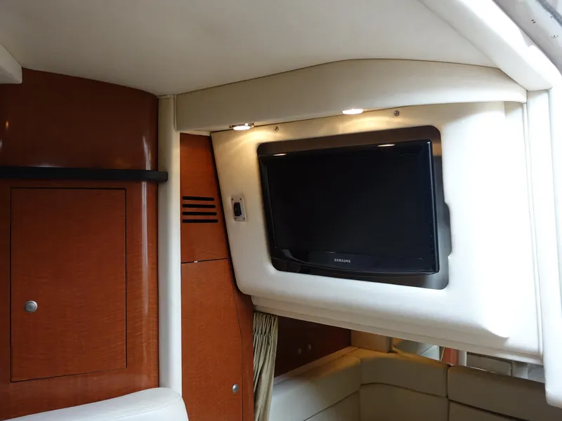 Slide: The Image of Interior of 2005 Sea Ray 320 Sundancer with TV and wood paneling. - 19