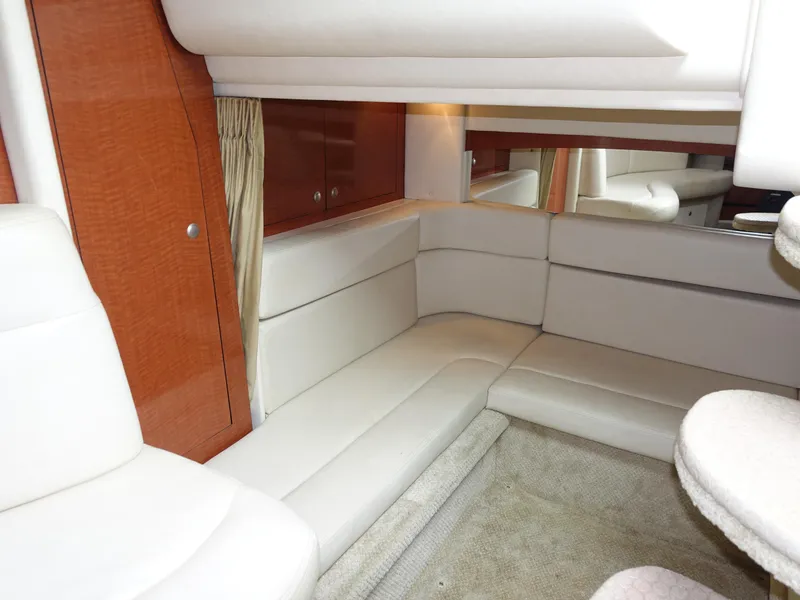 Slide: The Image of Luxurious interior of 2005 Sea Ray 320 Sundancer with cream leather seating. - 20