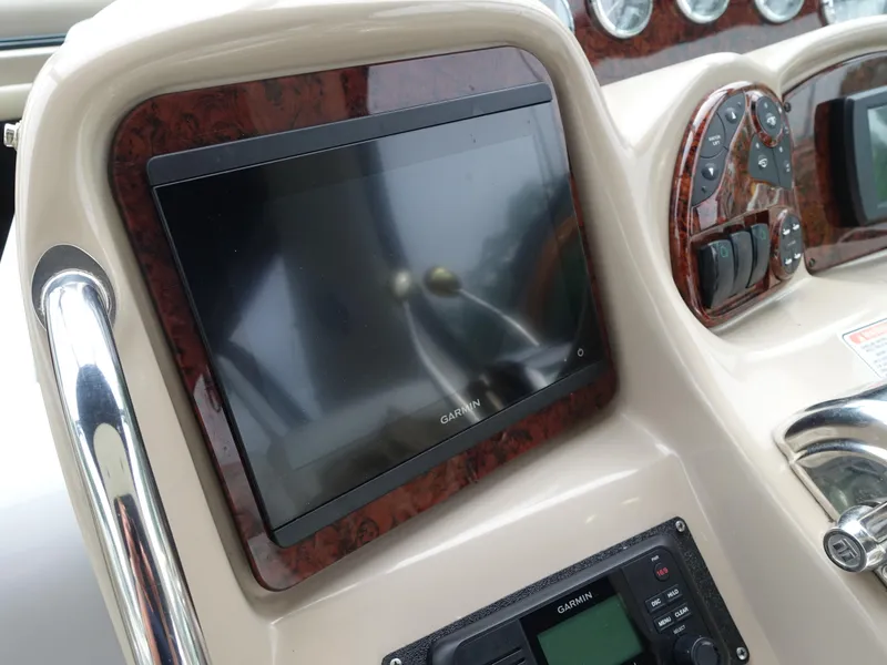 Slide: The Image of Dashboard of 2005 Sea Ray 320 Sundancer with Garmin display and controls. - 4
