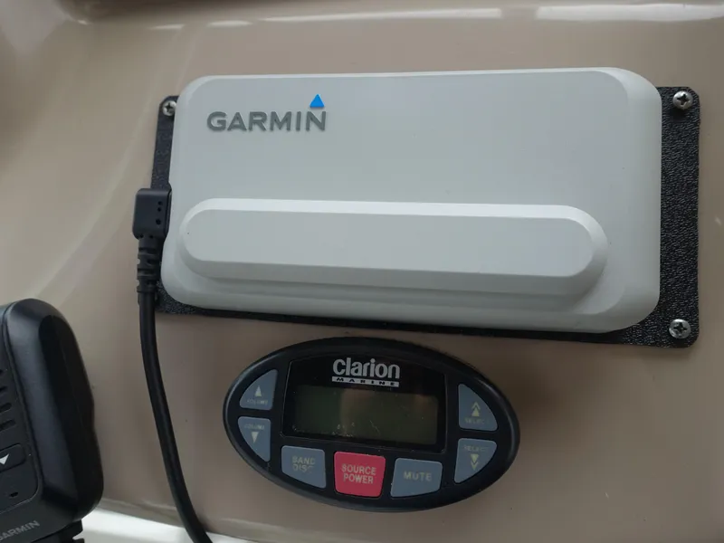 Slide: The Image of Garmin and Clarion devices on 2005 Sea Ray 320 Sundancer boat dashboard. - 6