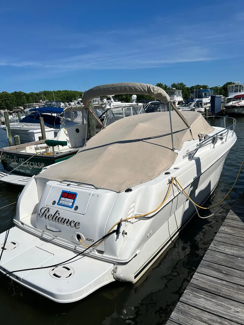 Slide: The Image of 2001 Sea Ray 270 Sundancer boat docked, covered, and for sale. - 0
