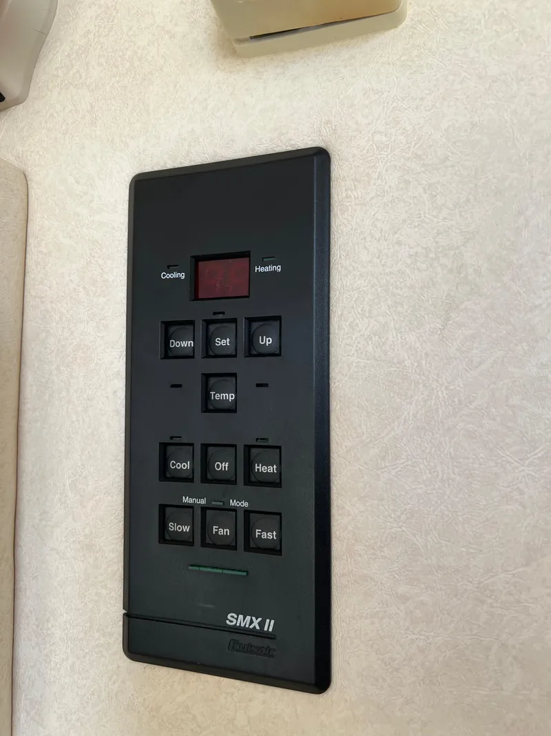 Slide: The Image of Sea Ray 270 Sundancer 2001 climate control panel, SMX II, black, wall-mounted. - 30