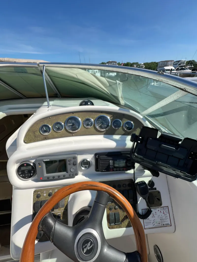 Slide: The Image of Dashboard of a 2001 Sea Ray 270 Sundancer boat with navigation instruments. - 40