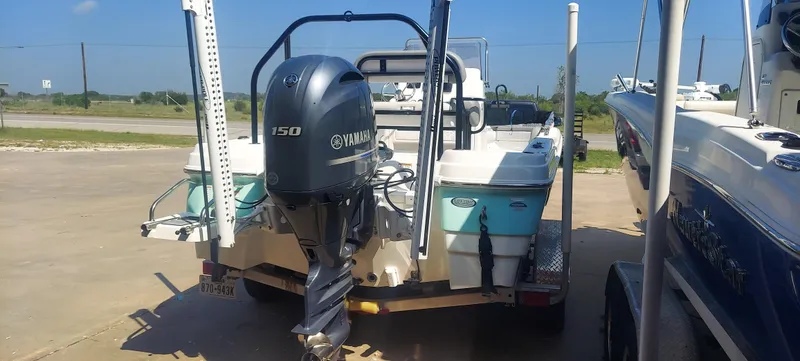 Slide: The Image of 2021 NauticStar 211 Hybrid boat with Yamaha 150 engine on trailer. - 11