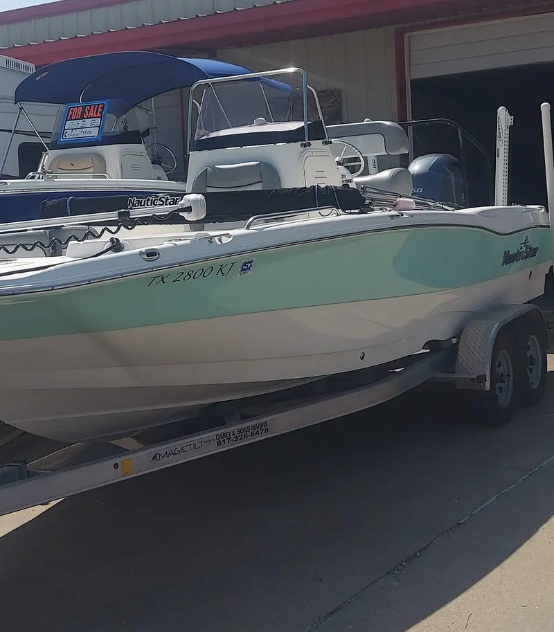 Slide: The Image of 2021 NauticStar 211 Hybrid boat on a trailer, for sale. - 13