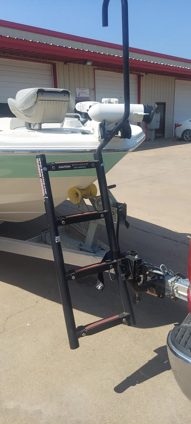 Slide: The Image of 2021 NauticStar 211 Hybrid boat with trailer and ladder attachment. - 22