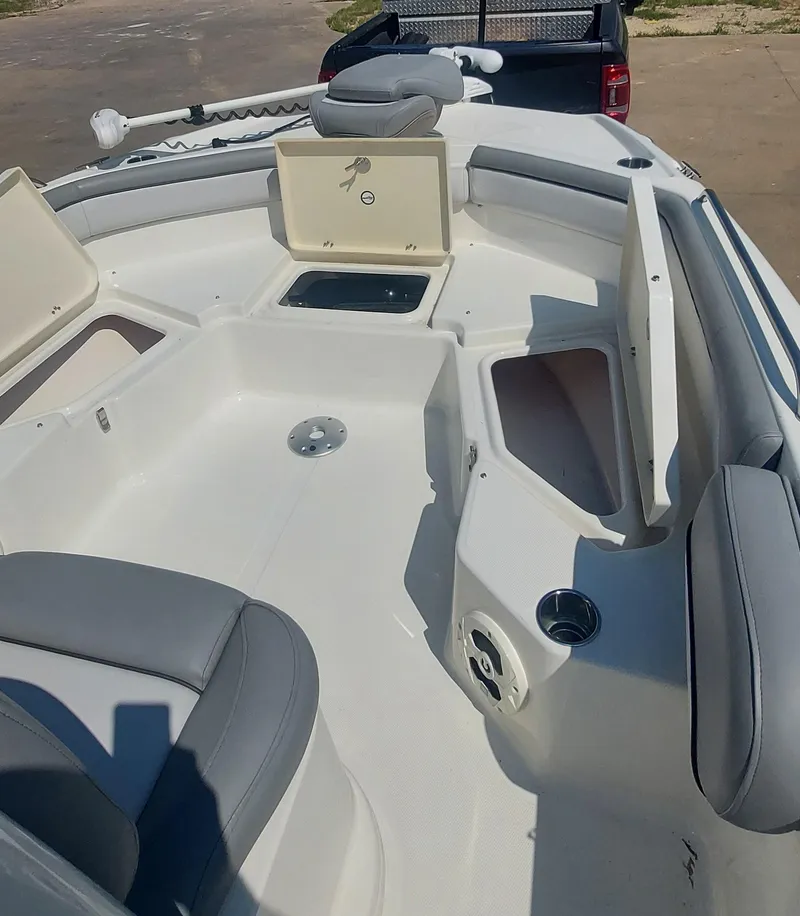 Slide: The Image of 2021 NauticStar 211 Hybrid boat interior with storage compartments and seating. - 4