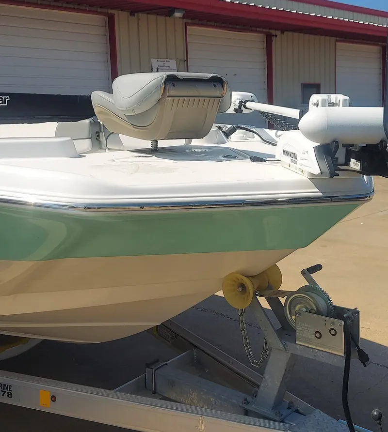 Slide: The Image of 2021 NauticStar 211 Hybrid boat on trailer, front view. - 5