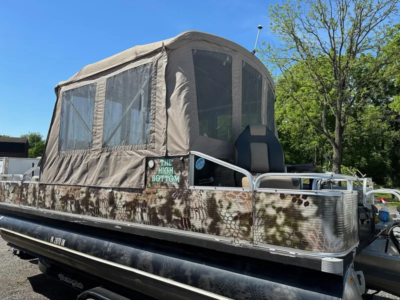 Slide: The Image of 2008 Avalon 2225 Fish pontoon boat with 2019 Evinrude 115 engine and 2020 trailer. - 11