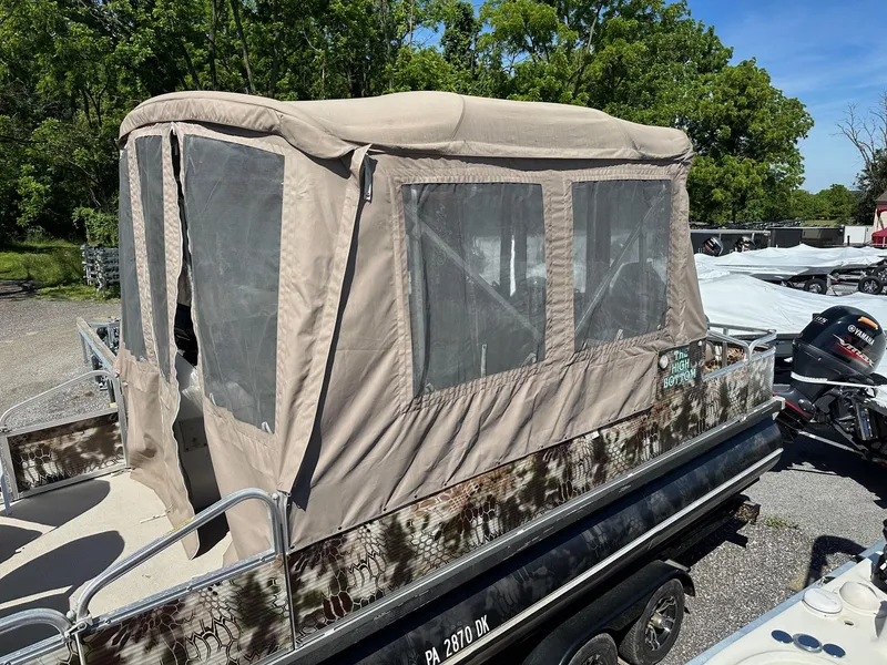 Slide: The Image of 2008 Avalon 2225 Fish pontoon boat with 2019 Evinrude 115 engine and 2020 trailer. - 18