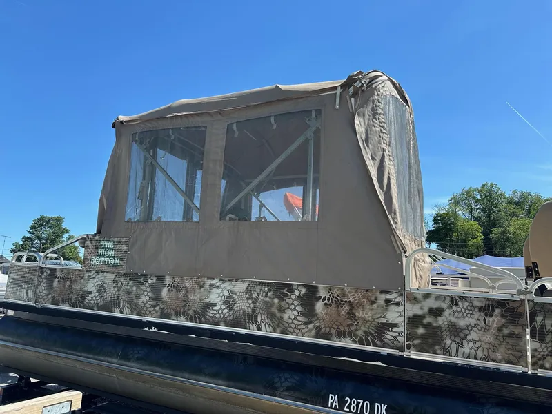 Slide: The Image of 2008 Avalon 2225 Fish pontoon boat with 2019 Evinrude 115 engine and 2020 trailer. - 19