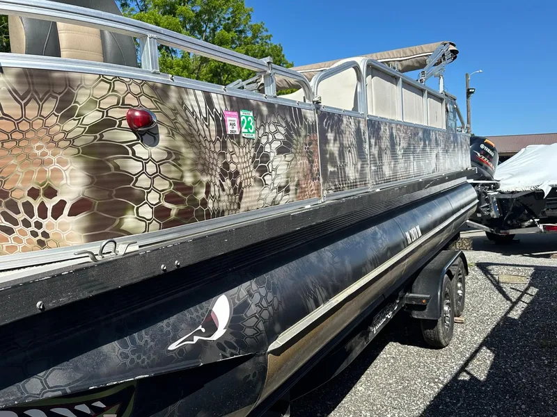 Slide: The Image of 2008 Avalon 2225 Fish pontoon boat with 2019 Evinrude 115 engine and 2020 trailer. - 2