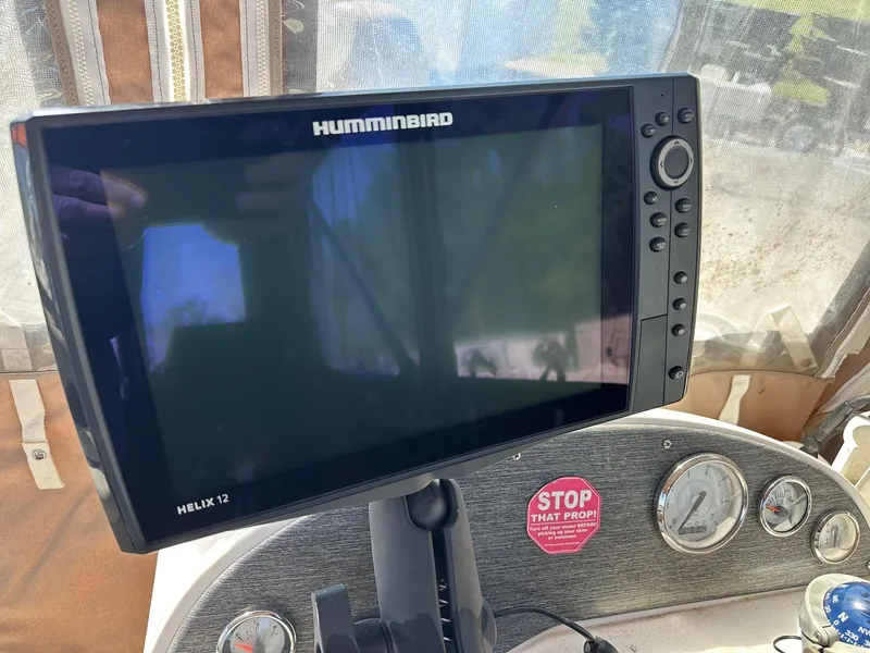 Slide: The Image of Humminbird Helix 12 fish finder on Avalon 2225 Fish boat dashboard. - 20
