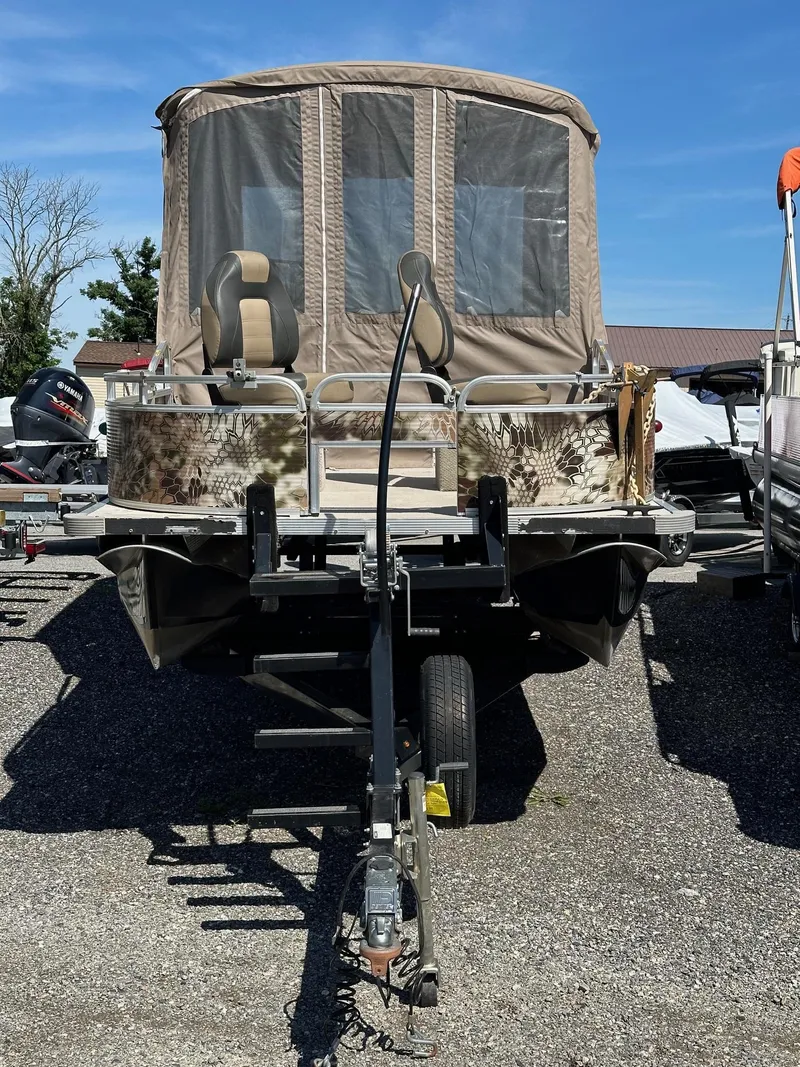 Slide: The Image of 2008 Avalon 2225 Fish pontoon boat with 2019 Evinrude 115 engine and 2020 trailer. - 23