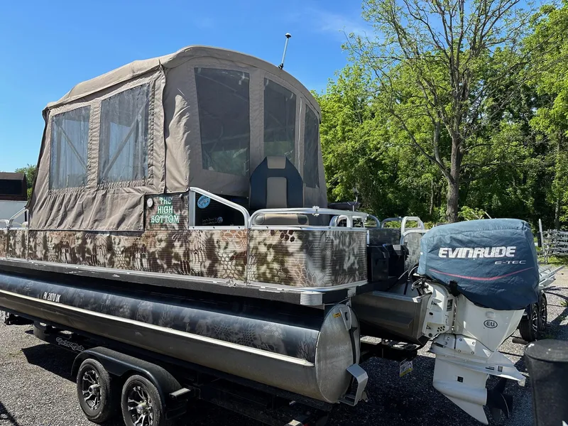 Slide: The Image of 2008 Avalon 2225 Fish pontoon boat with 2019 Evinrude 115 engine and 2020 trailer. - 25