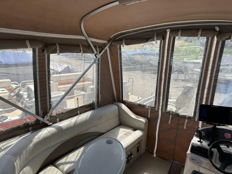 Slide: The Image of Interior of 2008 Avalon 2225 Fish boat with seating and control panel. - 7