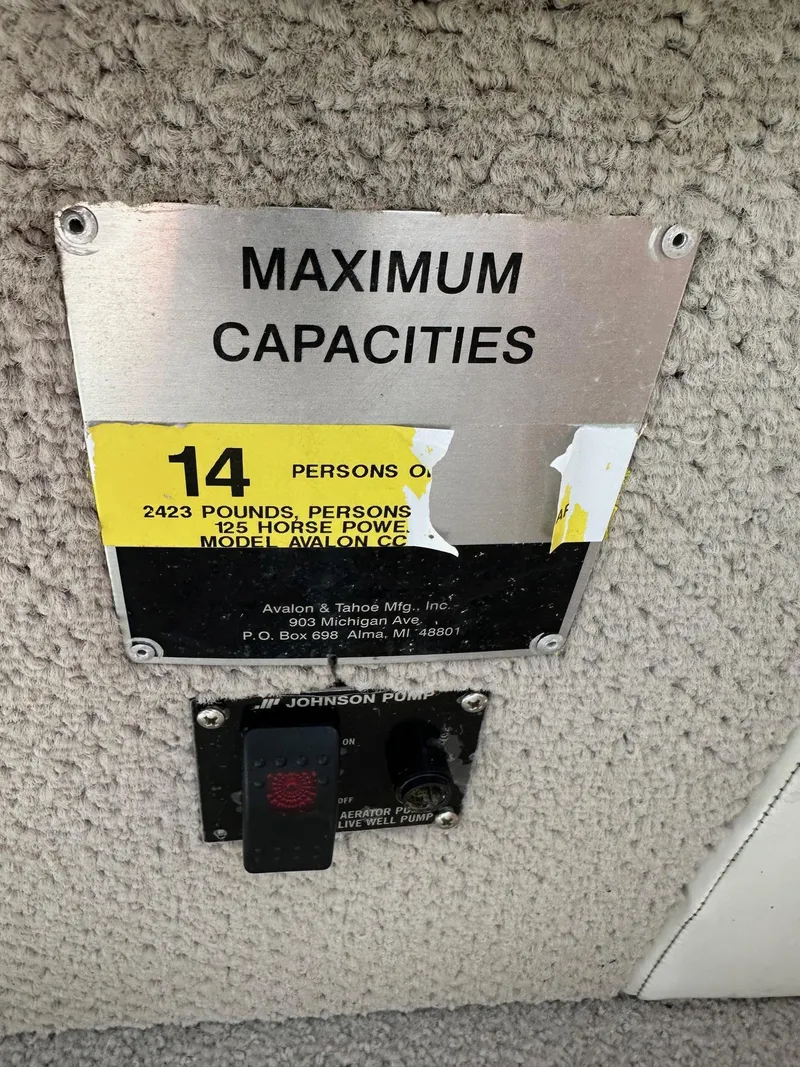 Slide: The Image of Maximum capacities plate on 2008 Avalon 2225 Fish boat, 14 persons, 2423 pounds, 125 horsepower. - 8