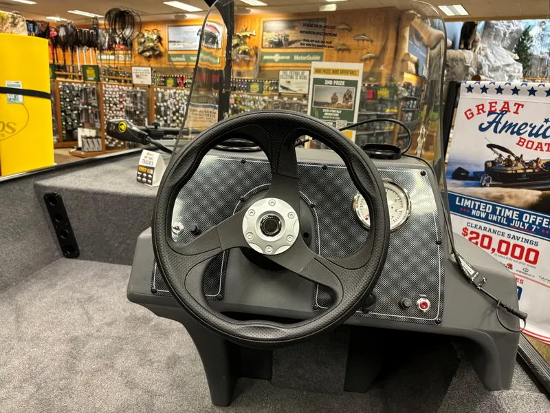 Slide: The Image of 2024 Tracker Bass Tracker Classic XL boat dashboard in showroom. - 3