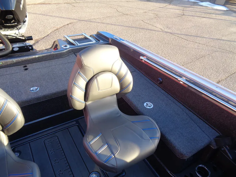 Slide: The Image of 2024 Nitro ZV20 boat interior with cushioned seats and storage compartments. - 14