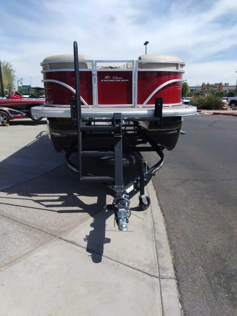 Slide: The Image of 2024 Sun Tracker Party Barge 24 DLX pontoon boat on a trailer. - 3