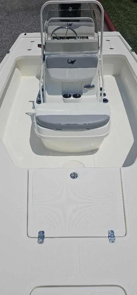 Slide: The Image of 2024 Mako 18 LTS boat interior with console and seating. - 4