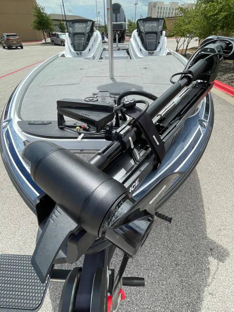 Slide: The Image of 2024 Nitro Z20 Pro fishing boat with advanced trolling motor, parked outdoors. - 5