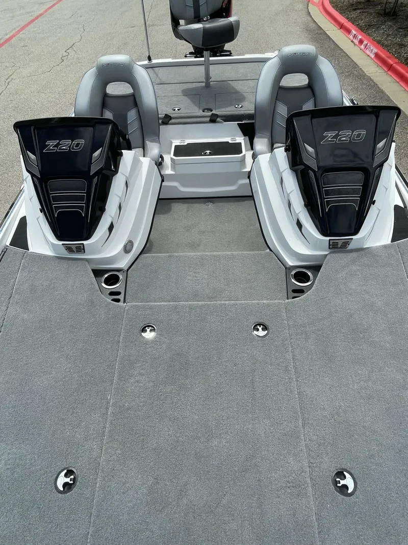 Slide: The Image of 2024 Nitro Z20 Pro boat interior with dual seats and storage compartments. - 7