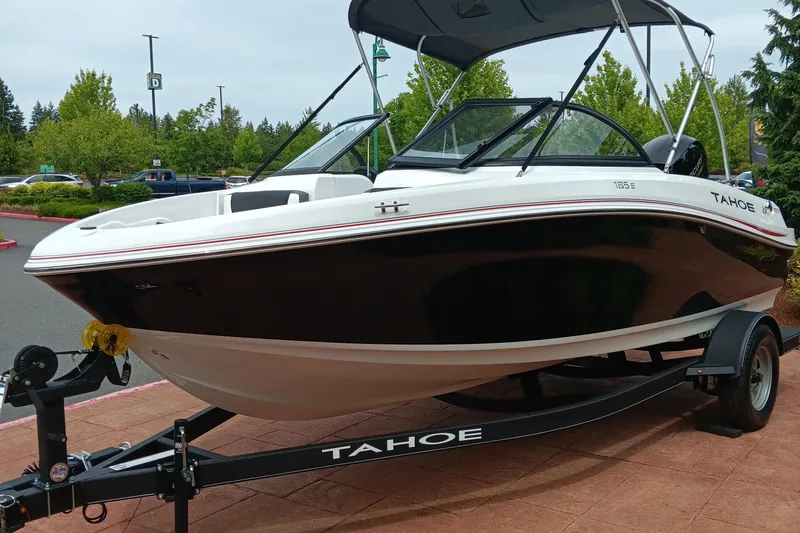 The Image of 2024 Tahoe 185 S boat on a trailer in a parking lot. - 0