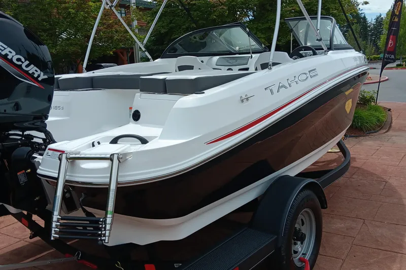 Slide: The Image of 2024 Tahoe 185 S boat on trailer, rear view with Mercury outboard motor. - 2