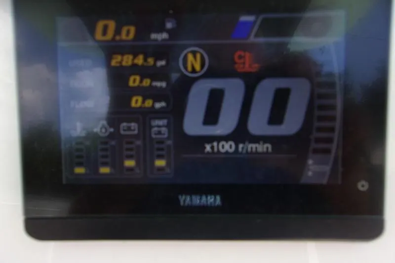 Slide: The Image of 2022 Key West 239FS boat dashboard display showing speed, fuel, and RPM metrics. - 10