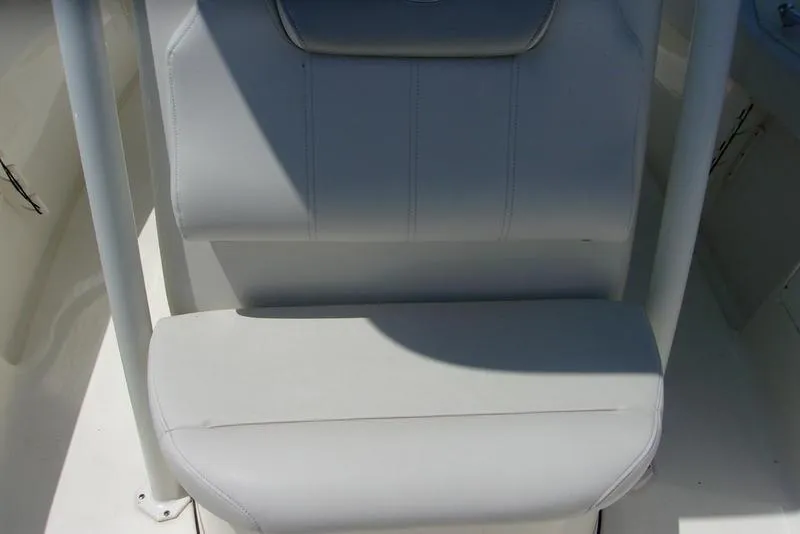 Slide: The Image of 2022 Key West 239FS boat seat with white upholstery. - 12
