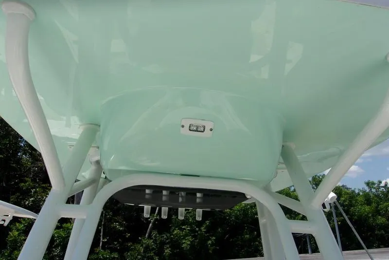 Slide: The Image of 2022 Key West 239FS boat T-top underside with light fixture. - 14