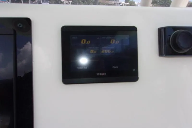 Slide: The Image of 2022 Key West 239FS boat dashboard with Yamaha display screen. - 17